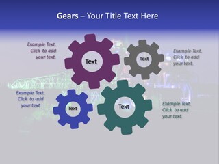 A Power Plant Lit Up At Night With Green And Blue Lights PowerPoint Template