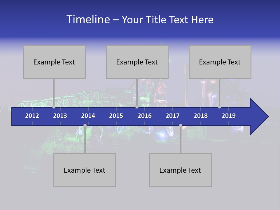 A Power Plant Lit Up At Night With Green And Blue Lights PowerPoint Template