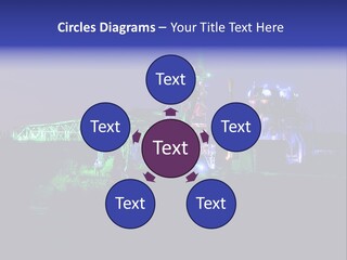 A Power Plant Lit Up At Night With Green And Blue Lights PowerPoint Template