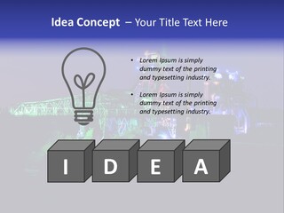 A Power Plant Lit Up At Night With Green And Blue Lights PowerPoint Template