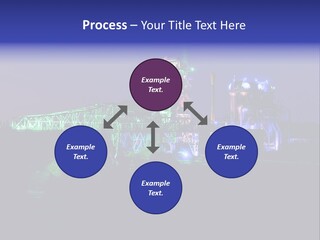 A Power Plant Lit Up At Night With Green And Blue Lights PowerPoint Template