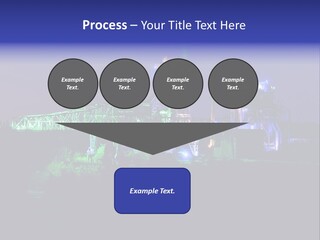 A Power Plant Lit Up At Night With Green And Blue Lights PowerPoint Template