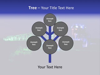 A Power Plant Lit Up At Night With Green And Blue Lights PowerPoint Template