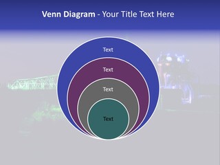 A Power Plant Lit Up At Night With Green And Blue Lights PowerPoint Template