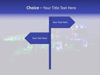 A Power Plant Lit Up At Night With Green And Blue Lights PowerPoint Template