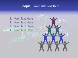 A Power Plant Lit Up At Night With Green And Blue Lights PowerPoint Template