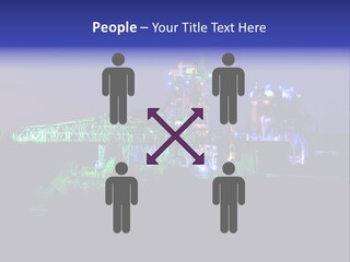 A Power Plant Lit Up At Night With Green And Blue Lights PowerPoint Template