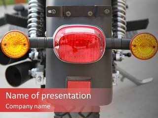 A Close Up Of A Motorcycle With A Red Light PowerPoint Template