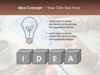 A Person Using A Tablet On A Table With A Cup Of Coffee PowerPoint Template