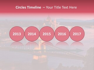 A Bridge Over A River With A City In The Background PowerPoint Template