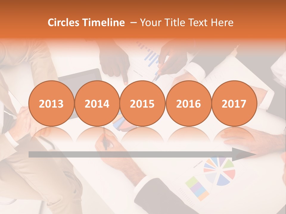 A Group Of Business People Sitting Around A Table PowerPoint Template