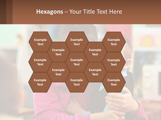 A Woman Holding A Small Child In Her Arms PowerPoint Template