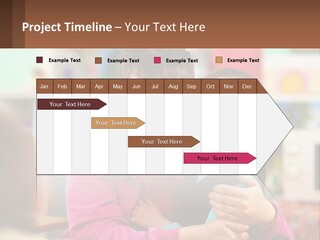 A Woman Holding A Small Child In Her Arms PowerPoint Template