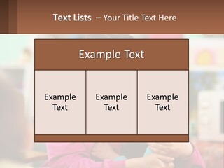 A Woman Holding A Small Child In Her Arms PowerPoint Template