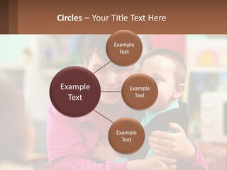 A Woman Holding A Small Child In Her Arms PowerPoint Template