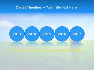 A Green Field With A Tree In The Middle Of It PowerPoint Template