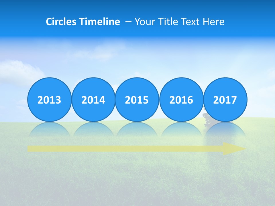 A Green Field With A Tree In The Middle Of It PowerPoint Template