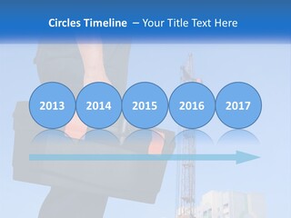 A Construction Worker Holding A Tool Box In Front Of A Crane PowerPoint Template