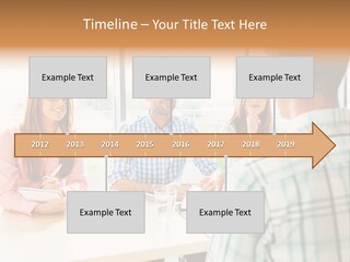A Group Of People Sitting Around A Table PowerPoint Template