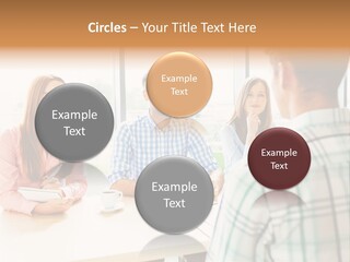 A Group Of People Sitting Around A Table PowerPoint Template