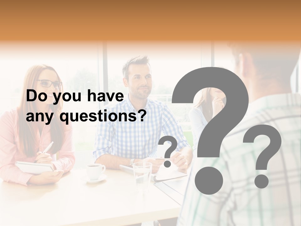 A Group Of People Sitting Around A Table PowerPoint Template