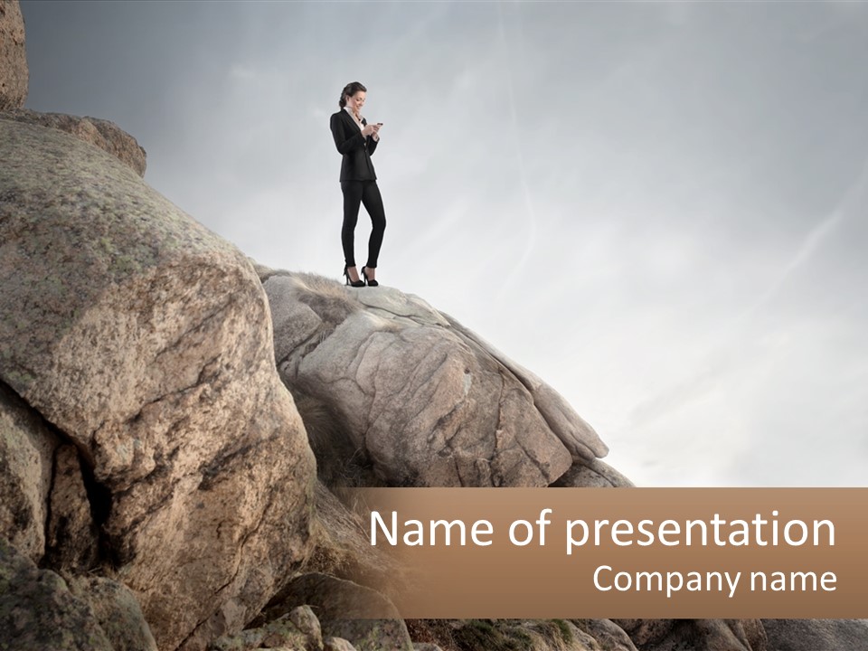 A Man In A Suit Standing On A Rock PowerPoint Template