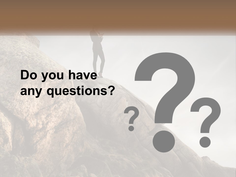 A Man In A Suit Standing On A Rock PowerPoint Template