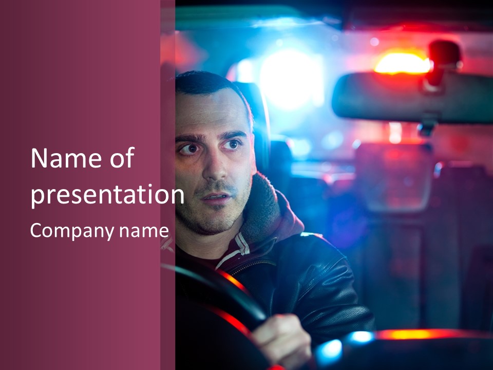 A Man Driving A Car With A Red Light In The Background PowerPoint Template