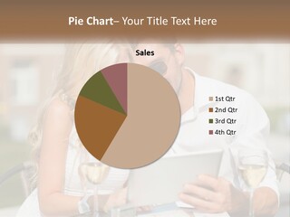 A Man And Woman Sitting At A Table With A Tablet PowerPoint Template
