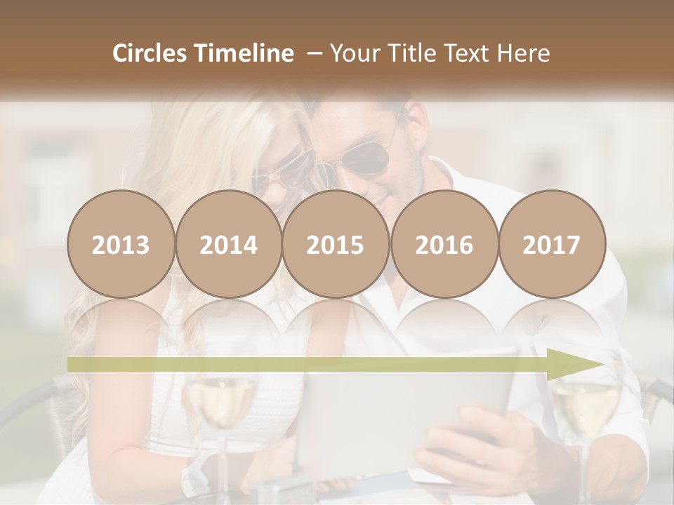 A Man And Woman Sitting At A Table With A Tablet PowerPoint Template