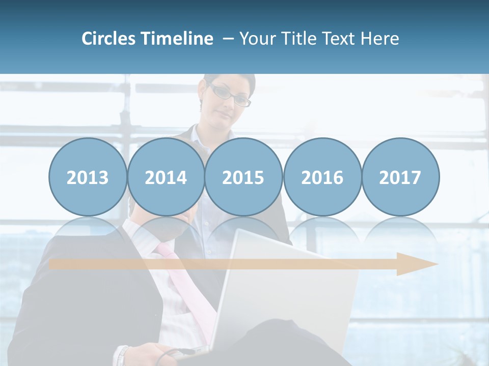 A Man And A Woman Are Looking At A Laptop PowerPoint Template