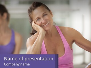 A Woman In A Pink Tank Top Smiles At The Camera PowerPoint Template