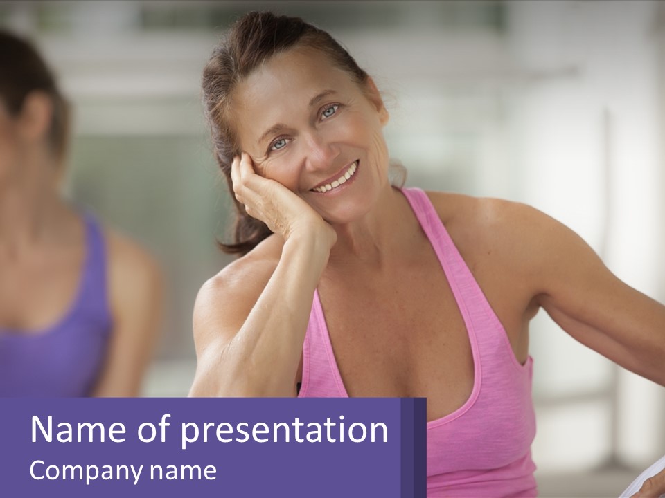 A Woman In A Pink Tank Top Smiles At The Camera PowerPoint Template
