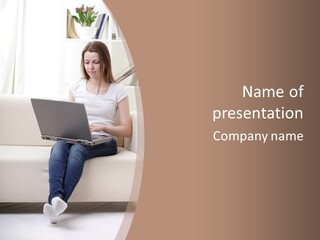 A Woman Sitting On A Couch Using A Laptop Computer PowerPoint Template
