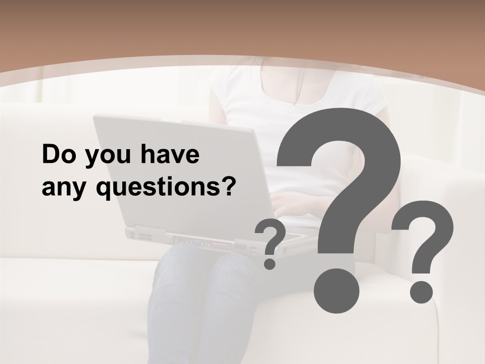 A Woman Sitting On A Couch Using A Laptop Computer PowerPoint Template