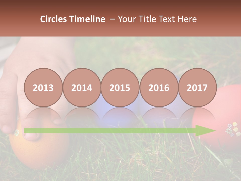 A Child's Hand Touching An Egg On The Grass PowerPoint Template