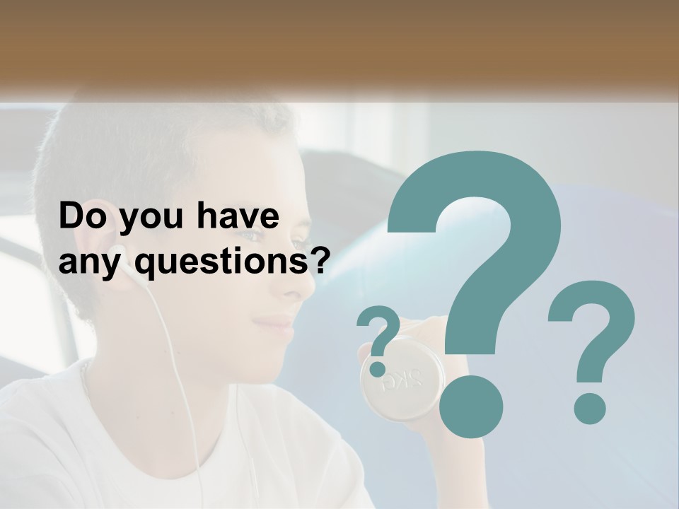 A Young Man Listening To Music With Headphones PowerPoint Template