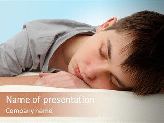 A Young Boy Sleeping On Top Of A Bed PowerPoint Template
