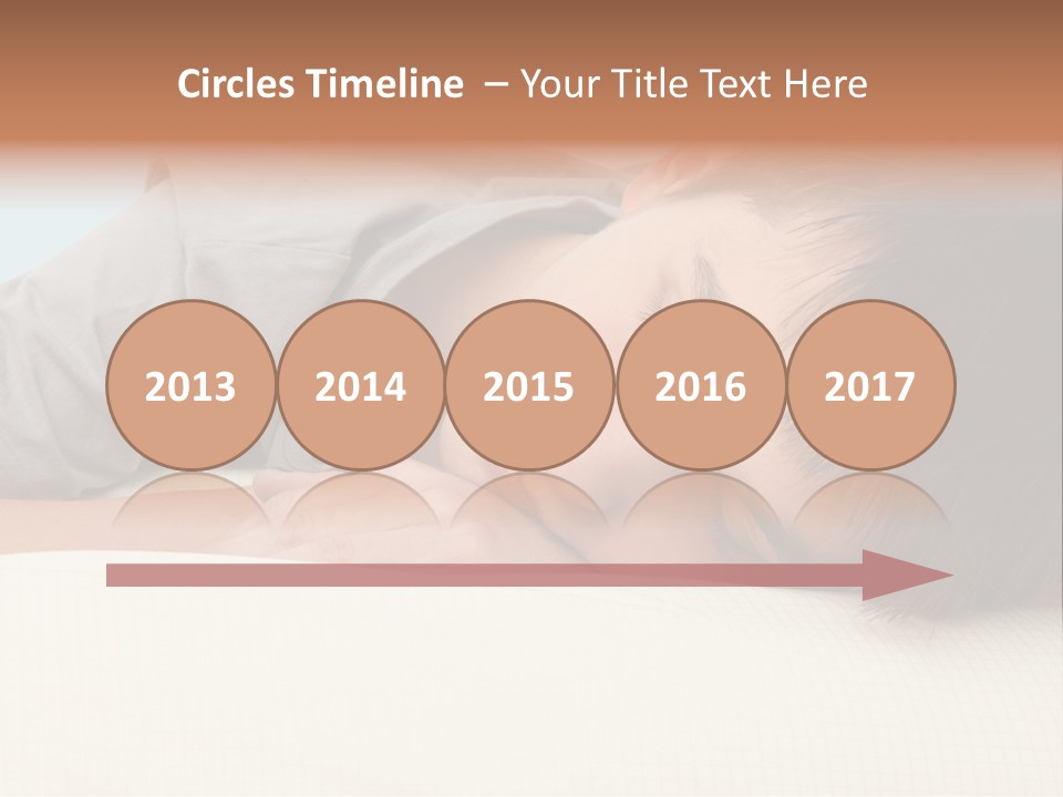 A Young Boy Sleeping On Top Of A Bed PowerPoint Template