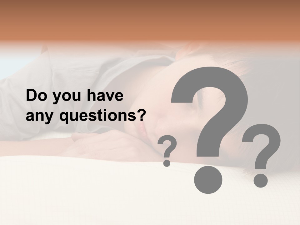 A Young Boy Sleeping On Top Of A Bed PowerPoint Template