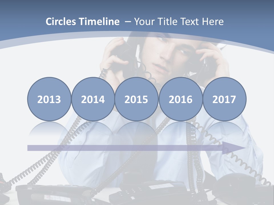 A Man In A Blue Shirt And Tie Talking On A Telephone PowerPoint Template