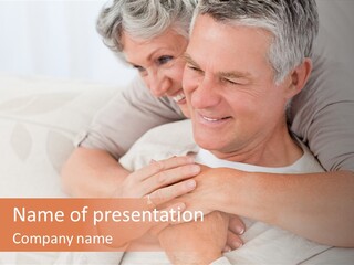 A Man And A Woman Hugging On A Couch PowerPoint Template