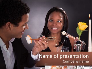 A Man And Woman Eating Sushi At A Restaurant PowerPoint Template