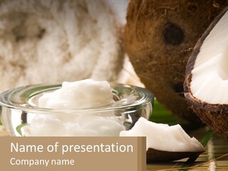 A Bowl Of Coconuts Next To A Cut In Half Coconut PowerPoint Template