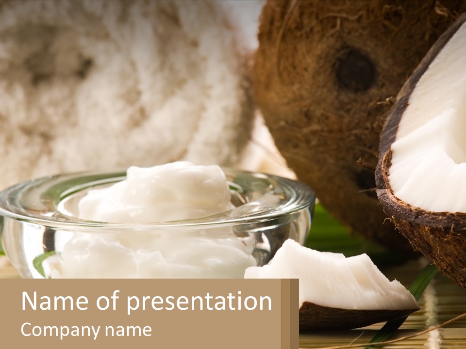 A Bowl Of Coconuts Next To A Cut In Half Coconut PowerPoint Template