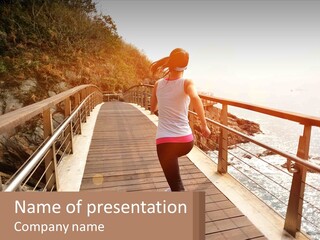 A Woman Walking Along A Wooden Bridge Over A Body Of Water PowerPoint Template