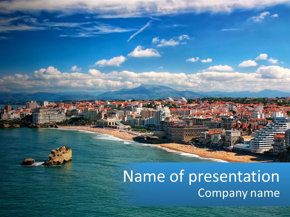 A View Of A Beach With A City In The Background PowerPoint Template