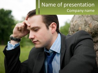 A Man In A Suit Sitting Next To A Tree PowerPoint Template