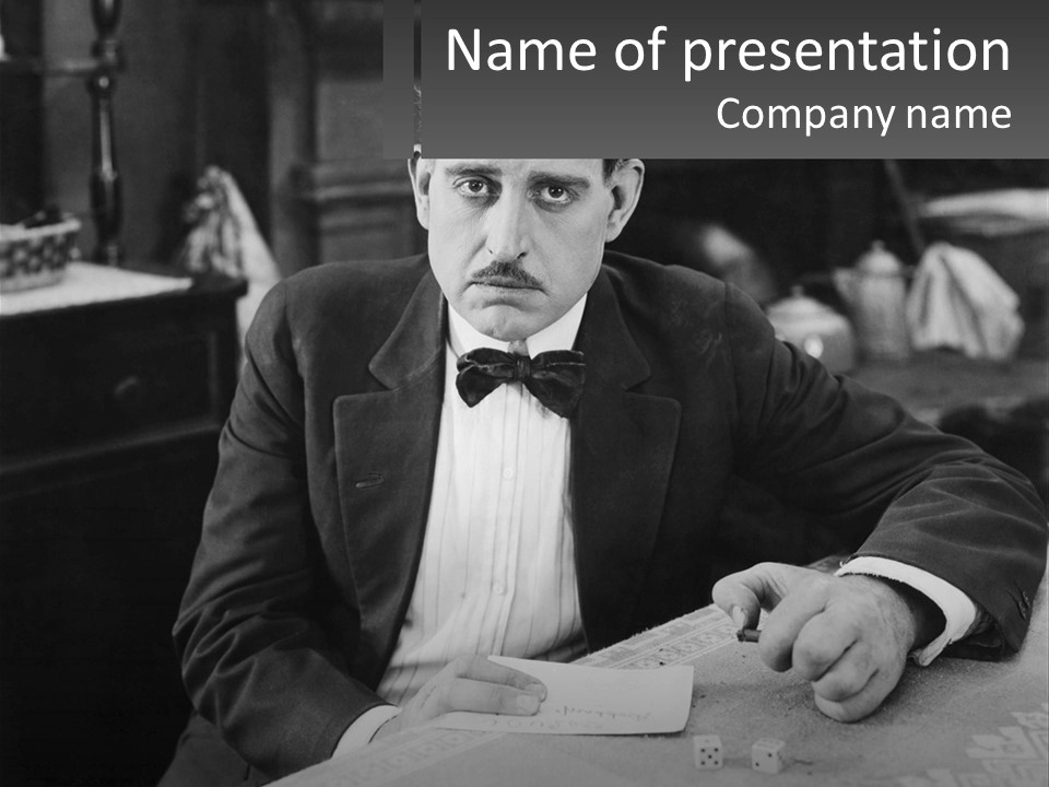 A Man In A Tuxedo Sitting At A Table PowerPoint Template