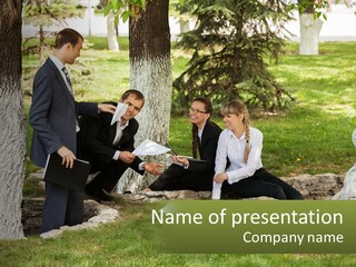 A Group Of People Sitting On The Ground In A Park PowerPoint Template